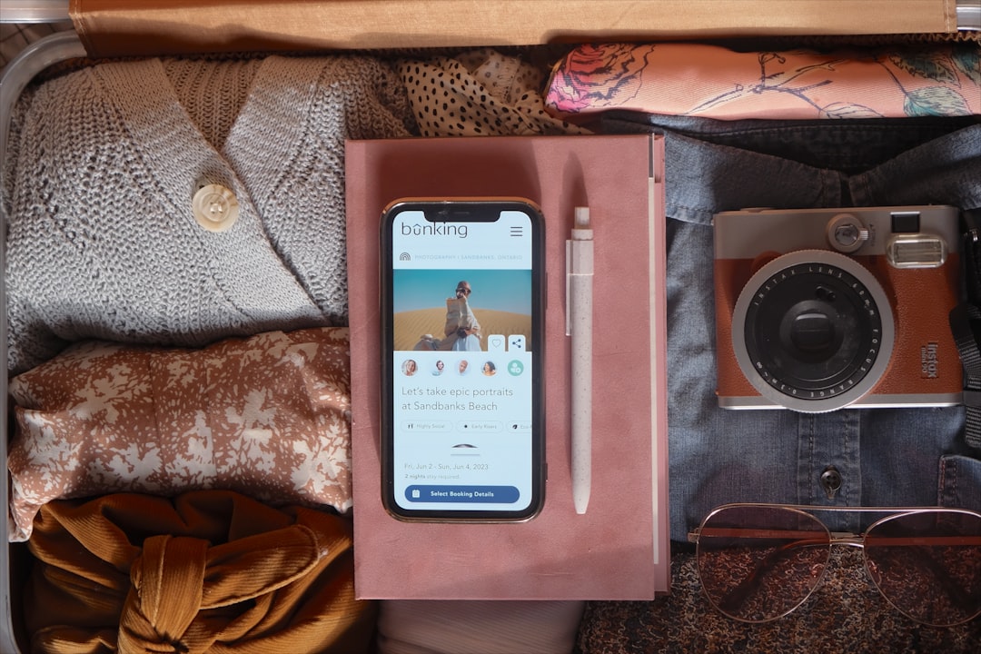 Nomad Protocol | Practical Solo Travel Traveler checking flight information on phone